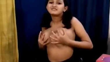 Teen indian school girl removing her school dress