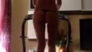 My real Desi Indian wife in thong walking on treadmil