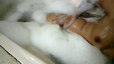 DESI BHABHI TEASEING BY STRIPING HER SAREE AND TAKING HOT SHOWER IN BATHTUB