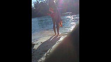 blonde sheds her top in public on river beach as butterfy shed cocoons