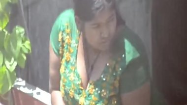 Desi mild aunty resting her big boobs on balcony